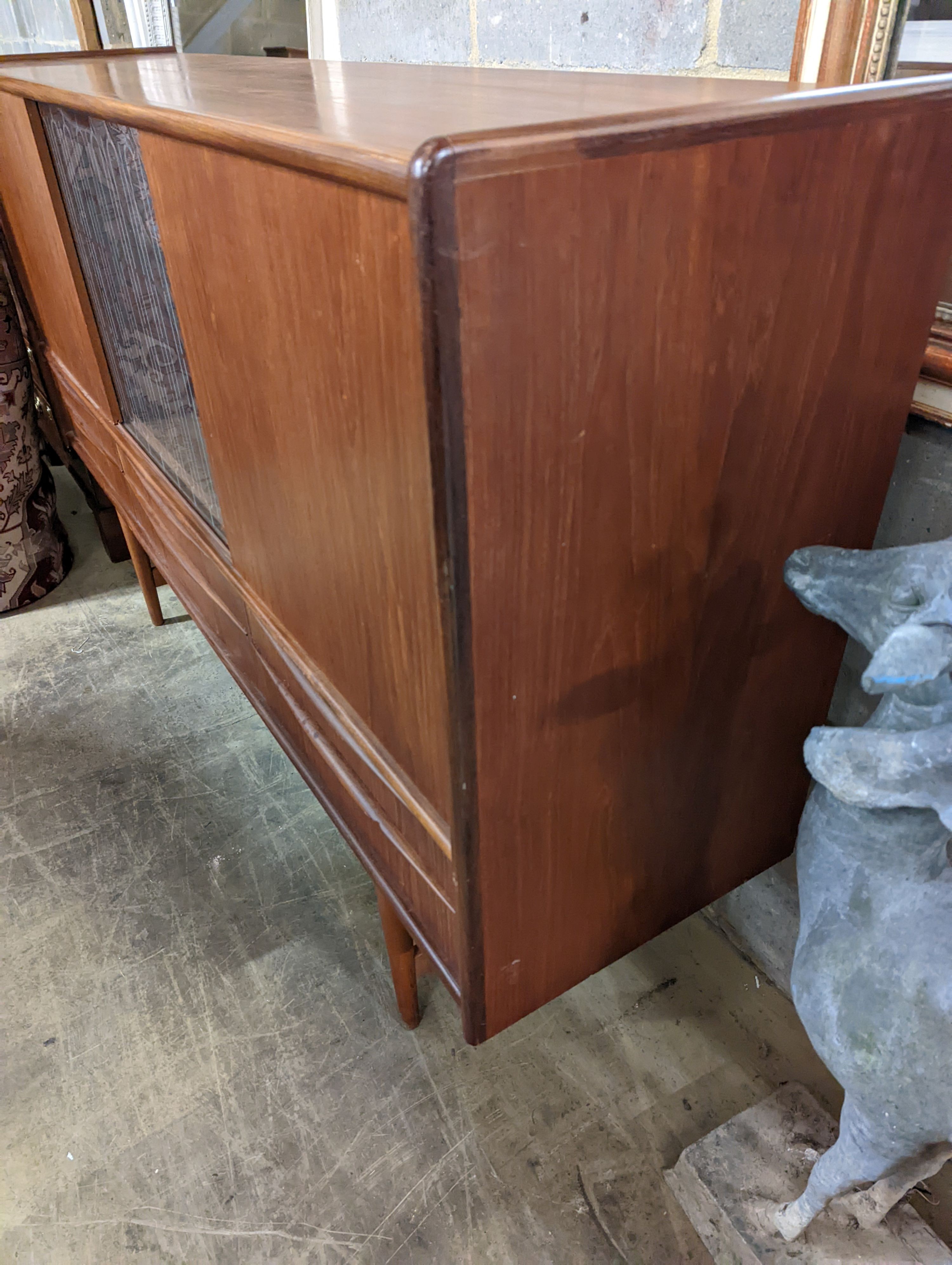 A mid century Danish teak sideboard, length 184cm, depth 44cm, height 115cm